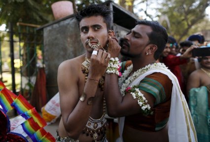 Participants get ready as they attend a gay pride parade promoting gay, lesbian, bisexual and transgender rights in Mumbai